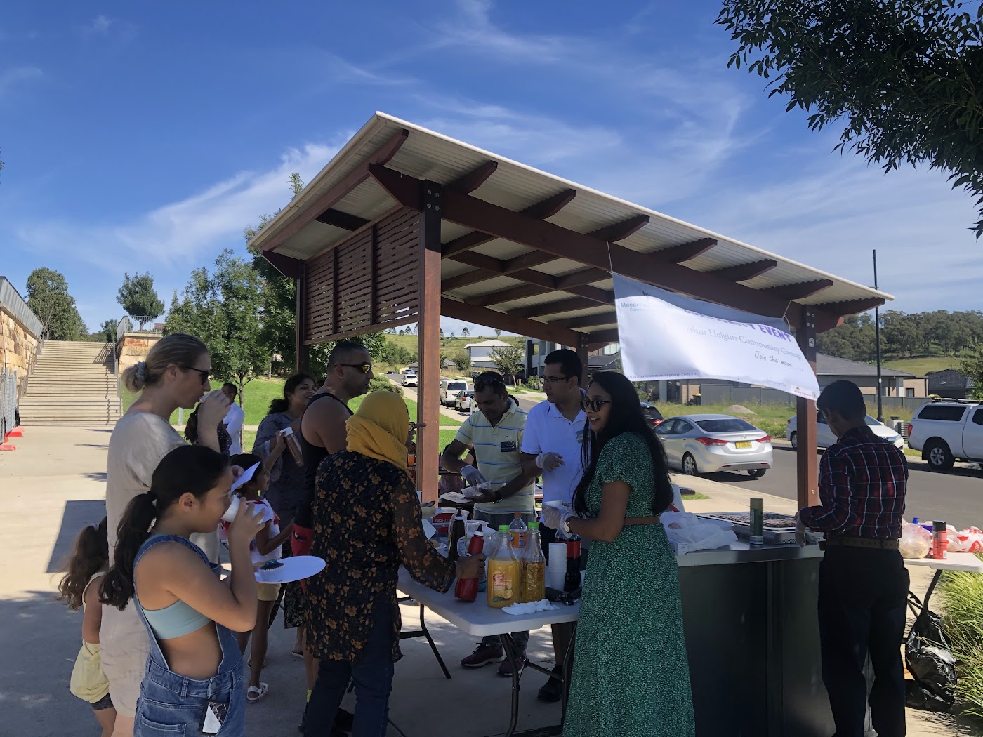 Residents talking with volunteers at the MHCG information stall